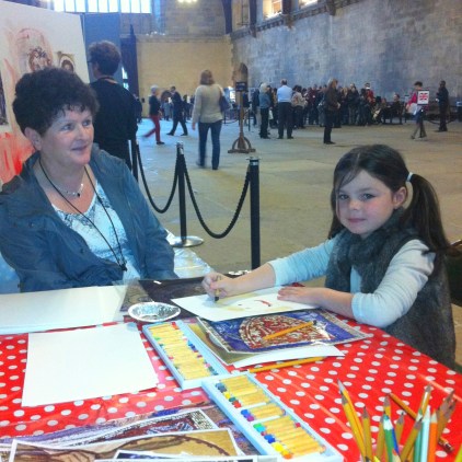 Asle (right) with a family member, in the Big Draw area in Westminster Hall, after the public tour of the Houses of Parliament. Photo credit Kelise Franclemont.
