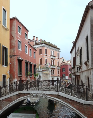 View of a canal bridge in a quiet avenue.