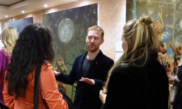 Artist Tom de Freston talking with visitors at 'Paintings after Shakespeare' at The Globe Theatre, London. Photo credit Kelise Franclemont.