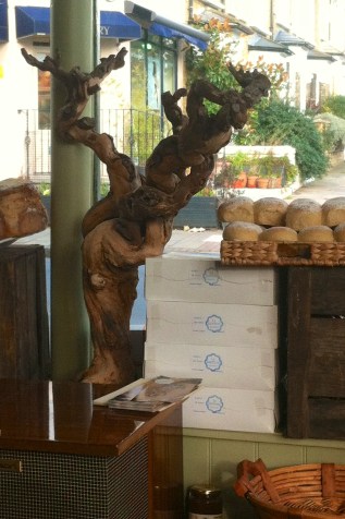 Driftwood sculpture in the window of my local Spanish deli, Photo credit Kelise Franclemont.