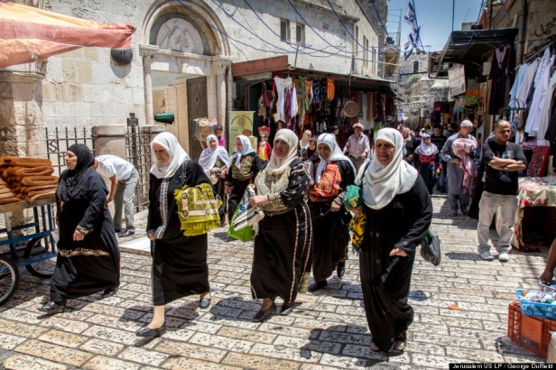 Muslim women in embroidered Palestinian dress on their way to mid-day prayer at Al-Aqsa Mosque, Haram al-Sharif, Jerusalem, in 'Jerusalem 3-D', 2013, documentary film, 45 mins. Image courtesy National Geographic and The Huffington Post. Photo credit George Duffield.