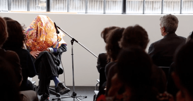 Screen shot from video recording of the artist talk in which Jimmie Durham dons a 'disguise' and discusses his practice, at Parasol Unit, 12 June 2014. Image courtesy Parasol Unit.