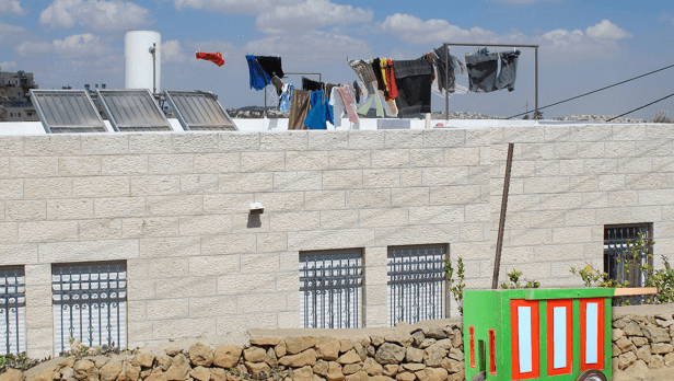 The front page of Disarming Design's website with a contemporary Ramallah 'Arabaya [seller's cart] for kids', wood, paint, and wheels, by Maher Shaheen, Annelys De Vet and Ahmed M Uwaidat. Image courtesy DisarmingDesign.ps