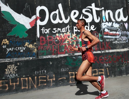 Nader al-Masri from Gaza in the Palestine Marathon with a time of 2:57, Bethlehem, Palestine (Occupied Territories), 27 March 2015. Photo courtesy EPA/JIM HOLLANDER.